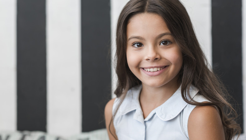 Red headed child with braces