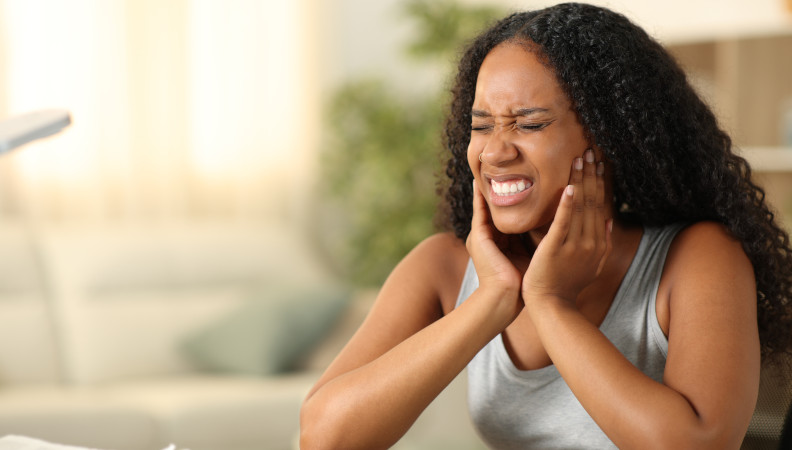 Woman dealing with tmj pain